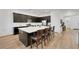 Modern kitchen featuring dark cabinetry, quartz countertops and stainless steel appliances at 712 Webber Park St, Henderson, NV 89011