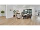 Bright living room with contemporary furnishings, neutral paint and wood-look floors at 712 Webber Park St, Henderson, NV 89011