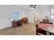 Inviting living area featuring wood floors, piano, and a cozy dining space at 712 Webber Park St, Henderson, NV 89011
