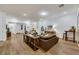 Bright living room boasts hardwood floors, neutral decor, and plenty of natural light at 712 Webber Park St, Henderson, NV 89011