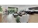 Open-concept living area with a modern kitchen, dining space, and comfortable seating at 712 Webber Park St, Henderson, NV 89011