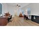 Versatile living space with wood floors, natural light, and a small dining area at 712 Webber Park St, Henderson, NV 89011