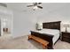 Spacious main bedroom boasts plush carpeting, ceiling fan, and dark wood furniture at 712 Webber Park St, Henderson, NV 89011