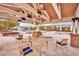 Relaxing outdoor lounge with comfortable seating and a view of the sparkling swimming pool and lush landscaping at 712 Webber Park St, Henderson, NV 89011