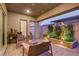 Cozy covered patio with elegant pavers, lovely plants, and a peaceful ambiance at 712 Webber Park St, Henderson, NV 89011