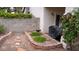Cozy backyard with a charming flowerbed, BBQ grill, and hardscape at 7313 Bosky Springs St, Las Vegas, NV 89131
