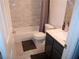 Clean, updated bathroom featuring modern vanity and shower with grey and white tile at 7313 Bosky Springs St, Las Vegas, NV 89131