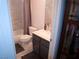 Clean, updated bathroom featuring modern vanity and shower with grey and white tile at 7313 Bosky Springs St, Las Vegas, NV 89131
