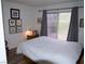Cozy bedroom featuring a sliding glass door that brings in plenty of natural light at 7313 Bosky Springs St, Las Vegas, NV 89131