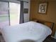 Neutral colored bedroom showing the sliding glass door to the exterior at 7313 Bosky Springs St, Las Vegas, NV 89131