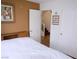 Neutral colored bedroom showing the staircase and closets at 7313 Bosky Springs St, Las Vegas, NV 89131