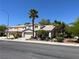 Charming two-story home with a well-manicured lawn and mature palm trees at 7313 Bosky Springs St, Las Vegas, NV 89131