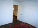View into a bedroom with white trim and wood floors from the hallway at 7313 Bosky Springs St, Las Vegas, NV 89131