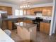 Updated kitchen featuring stainless steel appliances and a center island at 7313 Bosky Springs St, Las Vegas, NV 89131