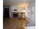 Cozy living room with a fireplace and large windows at 7313 Bosky Springs St, Las Vegas, NV 89131