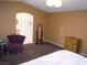 Spacious main bedroom featuring a sitting area, dresser and ensuite bathroom at 7313 Bosky Springs St, Las Vegas, NV 89131