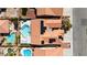An aerial view of homes with tile roofs, swimming pools, and solar panels at 7404 Dry Corral Ln, Las Vegas, NV 89113