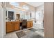 Bright bathroom featuring double sinks, vanity, and a separate tub and shower at 7404 Dry Corral Ln, Las Vegas, NV 89113