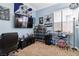 Bedroom featuring sports memorabilia, a TV, a drum set and a comfortable chair at 7404 Dry Corral Ln, Las Vegas, NV 89113