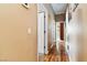 Hallway with wood-look floors that leads to several rooms in the house at 7404 Dry Corral Ln, Las Vegas, NV 89113