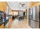 Modern kitchen with stainless appliances, and an open design to the Gathering room at 7404 Dry Corral Ln, Las Vegas, NV 89113