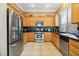 Modern kitchen featuring stainless steel appliances and granite countertops at 7404 Dry Corral Ln, Las Vegas, NV 89113