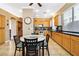 Charming eat-in kitchen with stainless steel appliances and warm wood cabinetry at 7404 Dry Corral Ln, Las Vegas, NV 89113