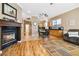 Open-concept with a fireplace, blending the living room and dining area at 7404 Dry Corral Ln, Las Vegas, NV 89113