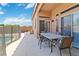 View of outdoor covered patio seating with access to yard and pool; great for relaxation and entertaining at 7404 Dry Corral Ln, Las Vegas, NV 89113