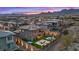 Enjoy the backyard featuring a fire pit, hot tub, outdoor dining area, pool, and mountain views at 754 Spirit Lake St, Las Vegas, NV 89138