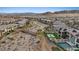 An aerial view showcasing the property's backyard oasis, complete with a pool, spa, and outdoor seating area at 754 Spirit Lake St, Las Vegas, NV 89138