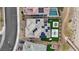 Overhead view of a residence with solar panels, a manicured lawn, a fire pit, and an outdoor lounge area at 754 Spirit Lake St, Las Vegas, NV 89138