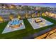 Luxurious backyard featuring a hot tub, lounge seating, and a fire pit for ultimate relaxation at 754 Spirit Lake St, Las Vegas, NV 89138