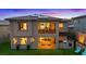 Spacious backyard boasts an outdoor kitchen, a covered patio, and manicured lawn perfect for entertaining at 754 Spirit Lake St, Las Vegas, NV 89138
