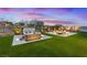 Backyard includes a luxurious hot tub, lounge seating, and a cozy fire pit, ideal for relaxation at 754 Spirit Lake St, Las Vegas, NV 89138