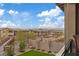 Scenic backyard offers views of the community, a bridge, and artificial turf landscaping at 754 Spirit Lake St, Las Vegas, NV 89138