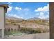 Well-manicured backyard featuring a putting green and picturesque mountain views at 754 Spirit Lake St, Las Vegas, NV 89138