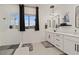 Bright bathroom featuring double sink vanity, modern lighting, and a walk-in glass shower at 754 Spirit Lake St, Las Vegas, NV 89138