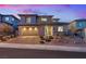 Beautiful home exterior featuring a two-car garage and a well-maintained front yard with desert landscaping at 754 Spirit Lake St, Las Vegas, NV 89138