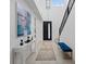 Elegant foyer with high ceilings, modern decor, staircase, and ample natural light creating a welcoming space at 754 Spirit Lake St, Las Vegas, NV 89138