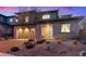 Charming home featuring a stone facade, a well-manicured front yard, and a two-car garage at 754 Spirit Lake St, Las Vegas, NV 89138