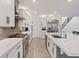 Modern kitchen with white cabinets, stainless steel appliances, large island, and ample counter space at 754 Spirit Lake St, Las Vegas, NV 89138
