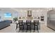 Stunning kitchen featuring a large island, stainless steel appliances, and seamless flow into the living area at 754 Spirit Lake St, Las Vegas, NV 89138