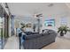 Spacious living room with large windows, tiled floor, ceiling fan and comfortable seating area at 754 Spirit Lake St, Las Vegas, NV 89138