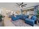 Open floor plan featuring living room area with comfortable seating and a view of the kitchen and dining area at 754 Spirit Lake St, Las Vegas, NV 89138