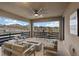 Covered outdoor patio boasts views, a dining set, and comfortable lounge seating at 754 Spirit Lake St, Las Vegas, NV 89138