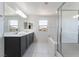Bright bathroom featuring a soaking tub and a dual sink vanity at 756 Sleeping City Ave, Henderson, NV 89015