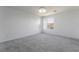 Large bedroom with plush carpet and two windows letting in natural light and neutral colored walls at 756 Sleeping City Ave, Henderson, NV 89015