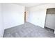 A well-lit bedroom featuring neutral carpet and bi-fold closet doors at 756 Sleeping City Ave, Henderson, NV 89015
