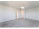Spacious bedroom with neutral colors and modern lighting fixture at 756 Sleeping City Ave, Henderson, NV 89015